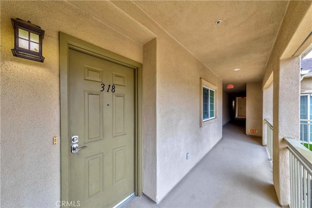 doorway to property featuring a balcony