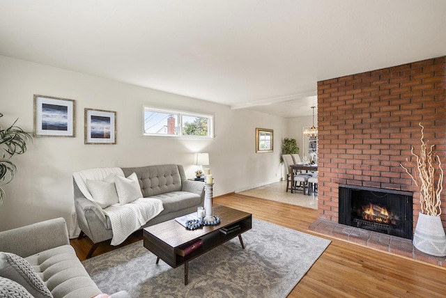 living room with hardwood / wood-style floors and a fireplace