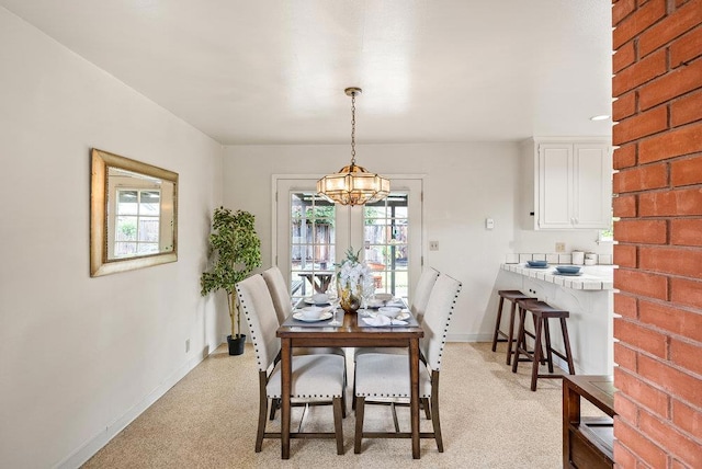 dining room with a notable chandelier