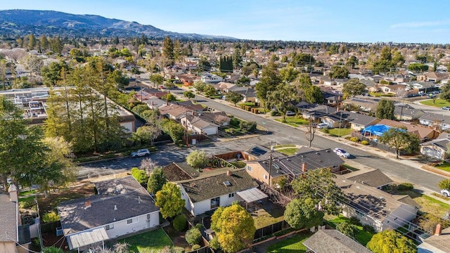 birds eye view of property with a mountain view