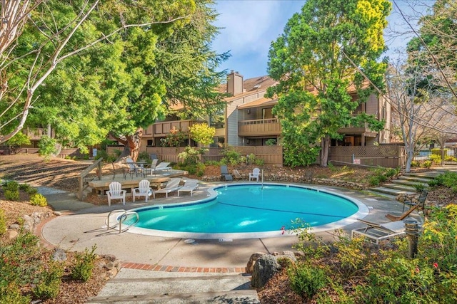 view of swimming pool featuring a patio