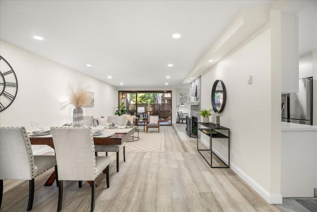 dining room with light wood-type flooring