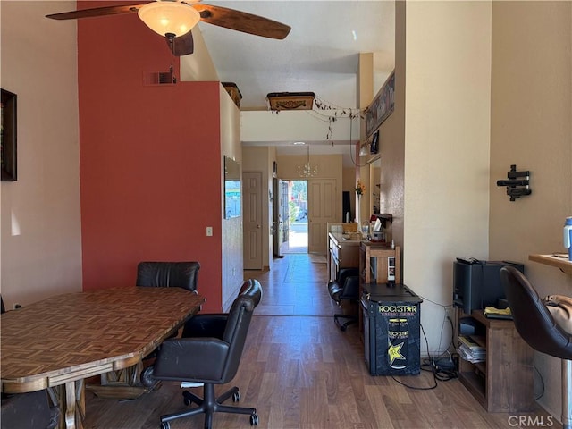 office space featuring wood finished floors, visible vents, and a ceiling fan