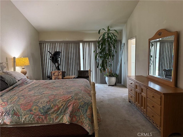 bedroom featuring light carpet