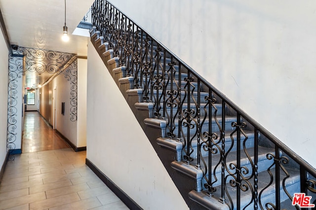 stairway with wood-type flooring