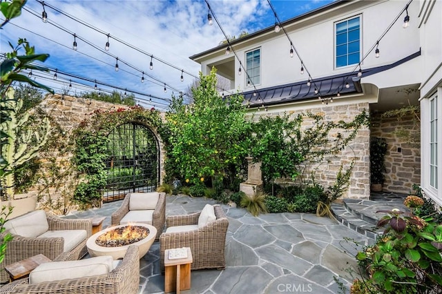 view of patio featuring a fire pit