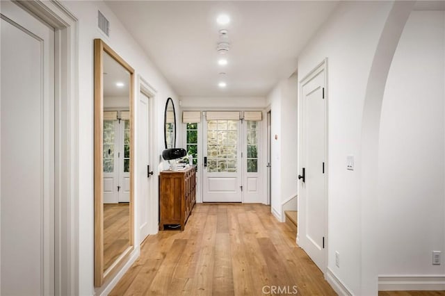 corridor featuring light hardwood / wood-style flooring