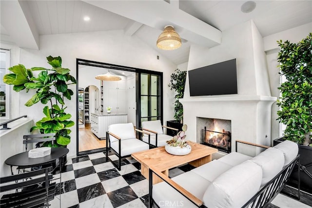 living room with lofted ceiling with beams