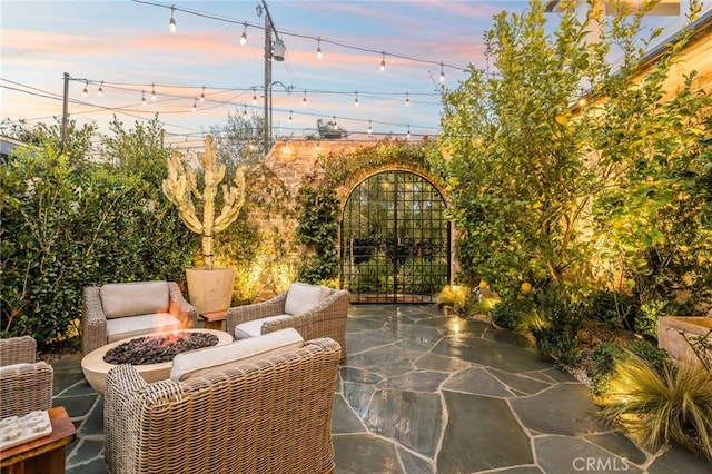 patio terrace at dusk with a fire pit