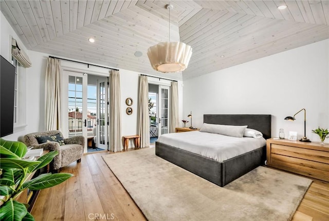 bedroom featuring wood ceiling, access to outside, and wood-type flooring