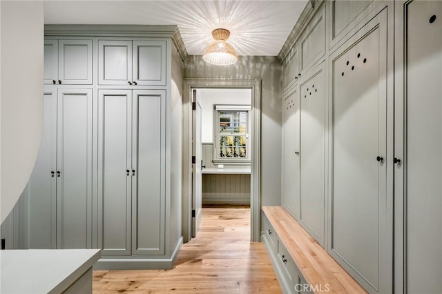 mudroom with light hardwood / wood-style floors