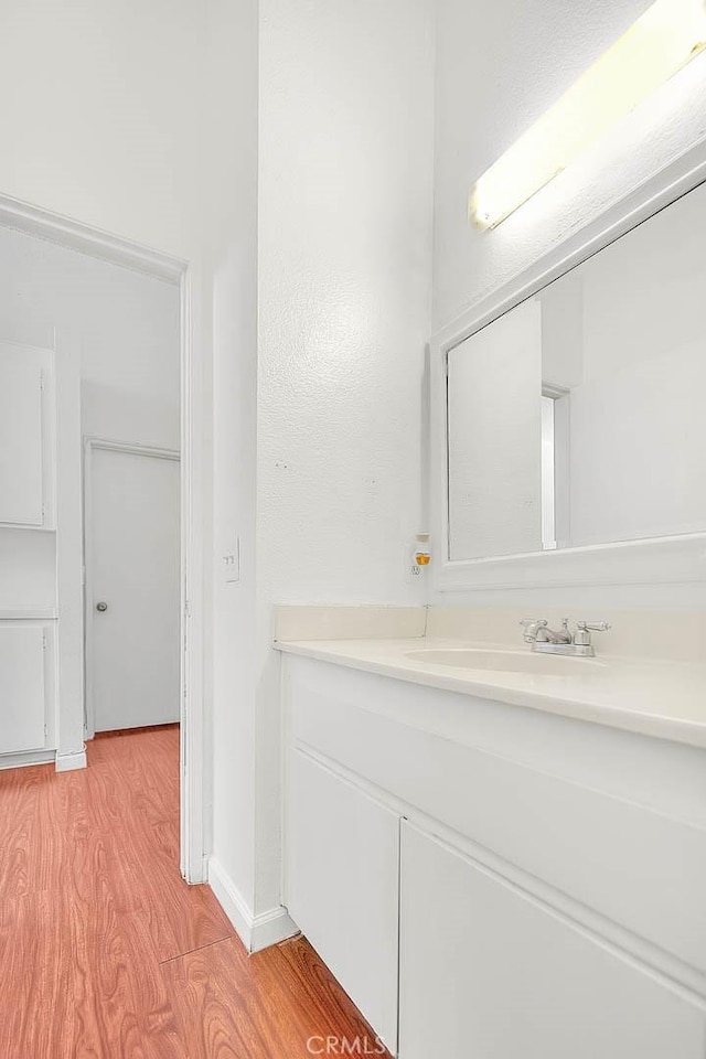 bathroom featuring sink and hardwood / wood-style floors