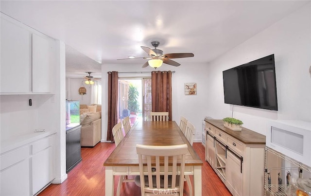 dining space featuring ceiling fan and light hardwood / wood-style floors