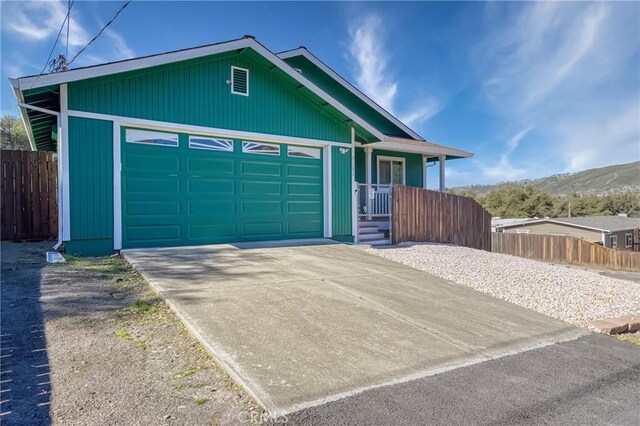 view of front of house featuring a garage and a mountain view