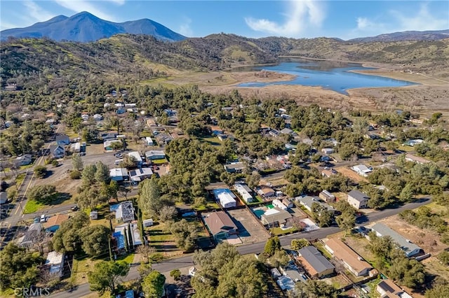 aerial view featuring a water and mountain view