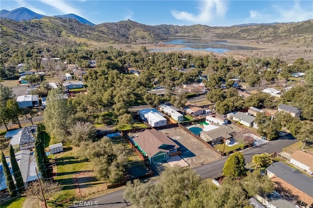 drone / aerial view with a water and mountain view