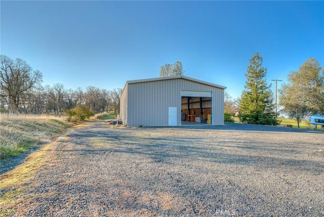 view of outbuilding featuring a garage