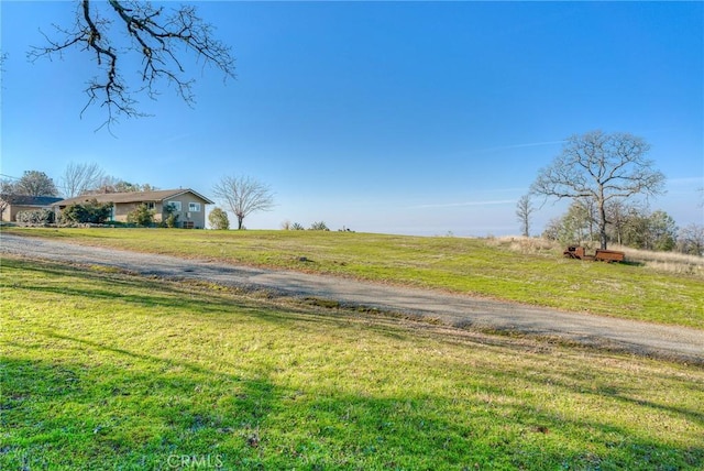 view of yard with a rural view