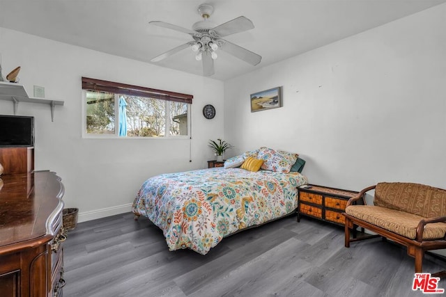 bedroom featuring ceiling fan and dark hardwood / wood-style flooring