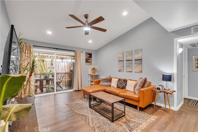 living room with lofted ceiling, light hardwood / wood-style flooring, and ceiling fan