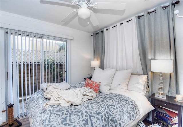 bedroom with wood-type flooring and ceiling fan