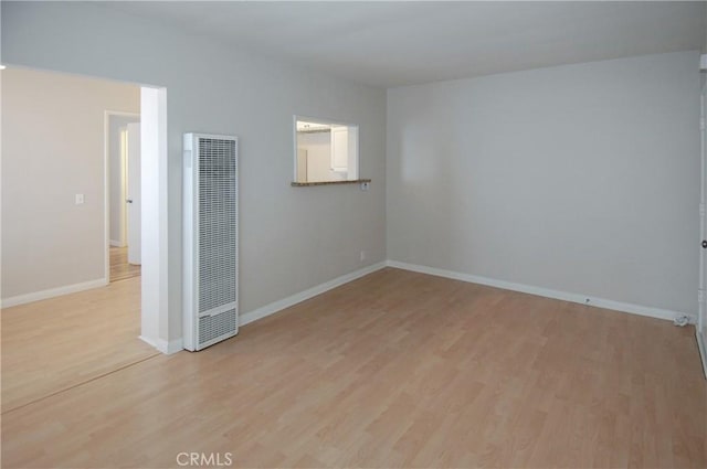 unfurnished room with light hardwood / wood-style floors