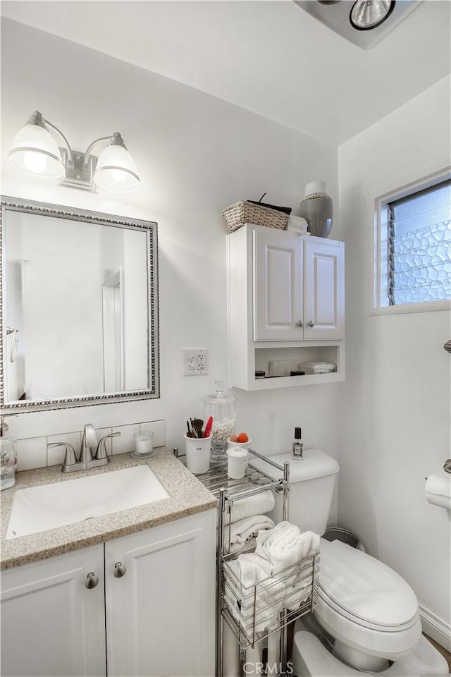 bathroom with vanity and toilet