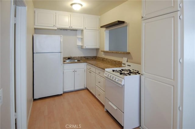 kitchen featuring white cabinetry, sink, white appliances, and light wood-type flooring