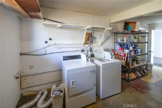 washroom with washer and dryer