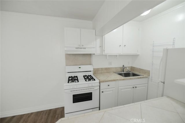 kitchen with white cabinetry, sink, white appliances, and crown molding