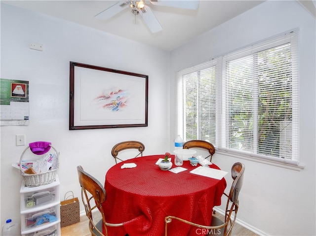 dining space with ceiling fan