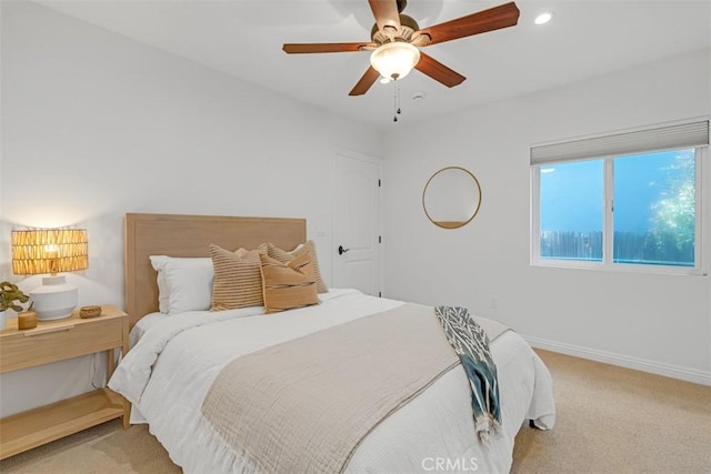 carpeted bedroom featuring ceiling fan