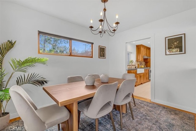 dining area featuring a chandelier and hardwood / wood-style floors