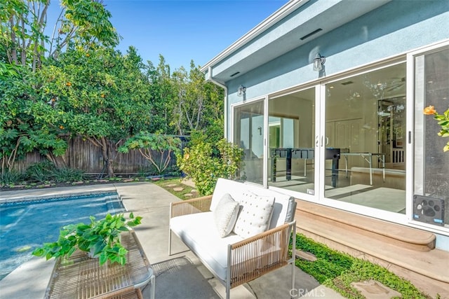 view of patio / terrace with a fenced in pool