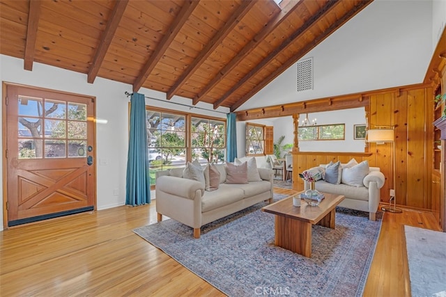 living room featuring beamed ceiling, wood ceiling, high vaulted ceiling, and light hardwood / wood-style flooring