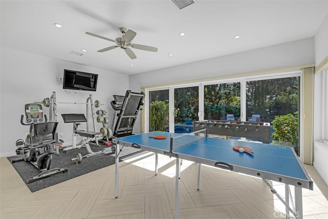 recreation room with light parquet floors and ceiling fan