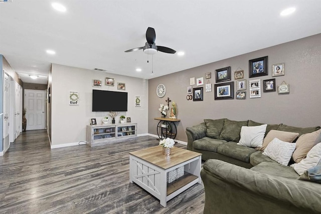 living room featuring hardwood / wood-style flooring and ceiling fan