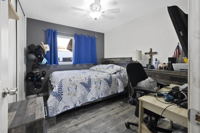 bedroom featuring hardwood / wood-style flooring and ceiling fan