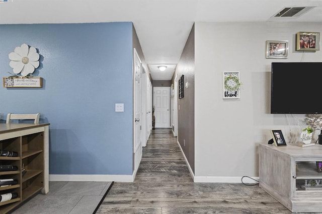 hallway featuring dark hardwood / wood-style floors