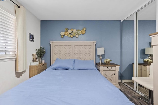 bedroom featuring dark hardwood / wood-style flooring