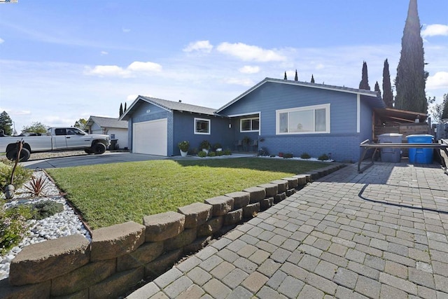 ranch-style home with a garage and a front yard