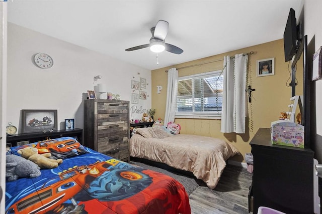 bedroom with hardwood / wood-style flooring and ceiling fan