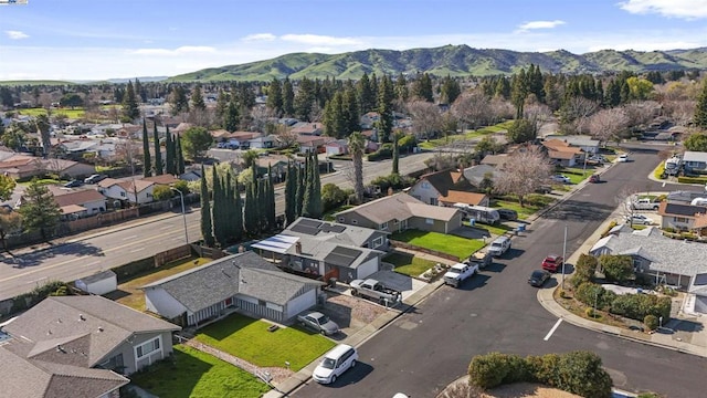 birds eye view of property with a mountain view