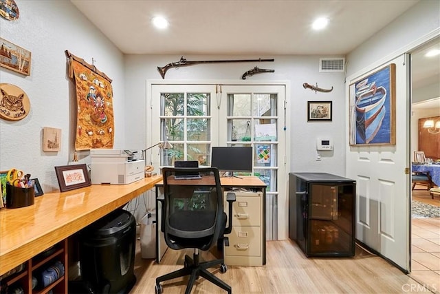 office space with light hardwood / wood-style floors