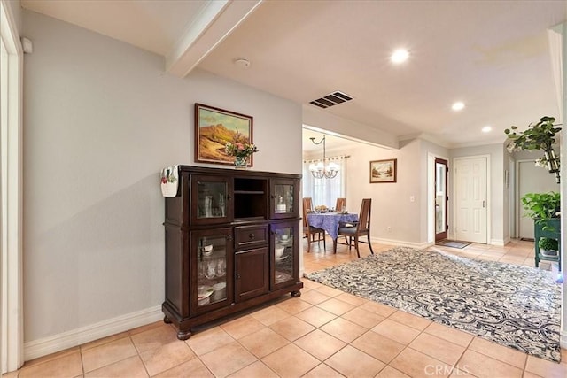 interior space featuring a chandelier and beam ceiling