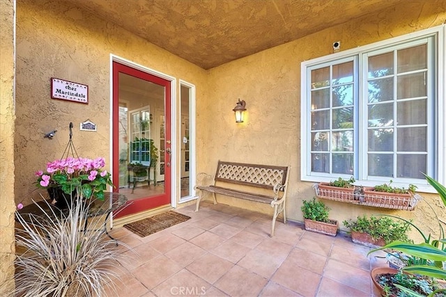 entrance to property with a patio