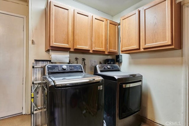 laundry area with cabinets and separate washer and dryer