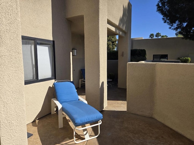 view of patio with a balcony