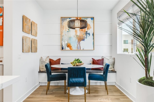 dining area with breakfast area and wood-type flooring