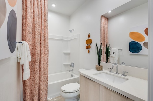 full bathroom featuring vanity, shower / bath combination with curtain, and toilet